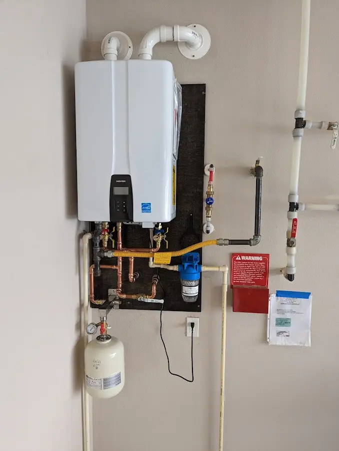 Professional plumber installing copper piping in a Cisco home